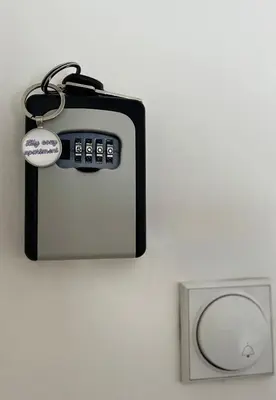 a key chain is attached to a wall at Lily Cozy Apartment in Niš