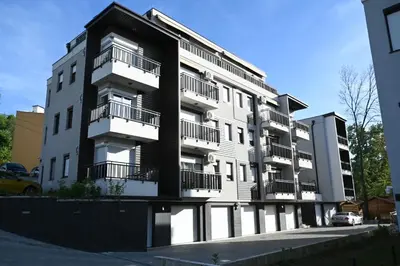 an apartment building with balconies on the side of it at Apartman Vera 8 VRNJAČKA BANJA in Vrnjačka Banja