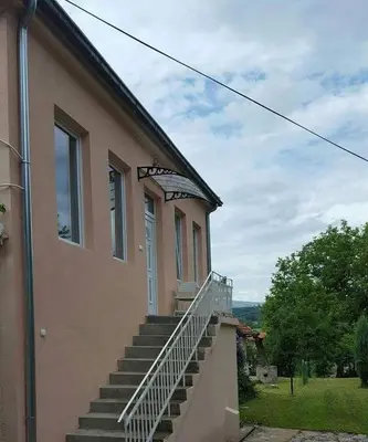 a building with stairs on the side of it at Apartman LUKA 2 in Soko Banja