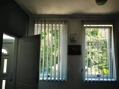 a room with a window with vertical blinds at Apartman LUKA 2 in Soko Banja