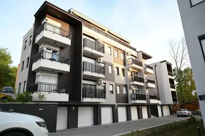 a building with balconies on the side of it at Apartman Aleksa 5 VRNJAČKA BANJA in Vrnjačka Banja