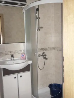 a bathroom with a shower and a sink at Apartman Sanja in Vrnjačka Banja