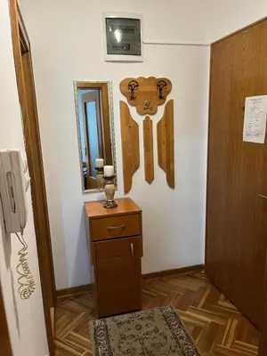 a room with a door with a cross on the wall at Apartman Sanja 3 in Vrnjačka Banja