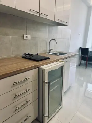 a kitchen with a sink and a counter top at 407 Elegant in Vrnjačka Banja