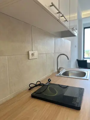 a laptop sitting on a counter in a kitchen at 407 Elegant in Vrnjačka Banja
