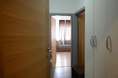 an open door to a living room with a couch at Garni Hotel Lion in Jagodina