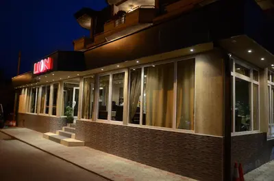 a building with a sign on the side of it at Garni Hotel Lion in Jagodina