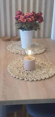 a table with a candle and a vase of roses at Apartman TADEJ & FREE PARKING in Vrnjci
