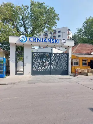 a gas station with a gate in front of it at Harmony Studio Suite in Jagodina