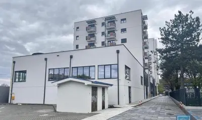 a large white building with a lot of windows at Harmony Studio Suite in Jagodina