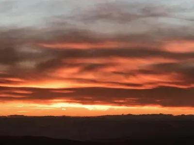 a sunset in the sky with clouds at Golden Hour in Kopaonik