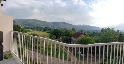 a balcony with a view of the mountains at Apartman sa pogledom na Ozren in Soko Banja