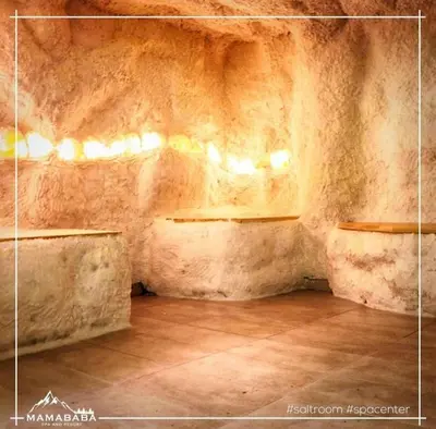 a room with two benches in a stone wall at Milmari L39 Kopaonik in Kopaonik