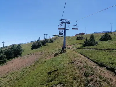 a hill with a chair lift on it at Husky N in Raška