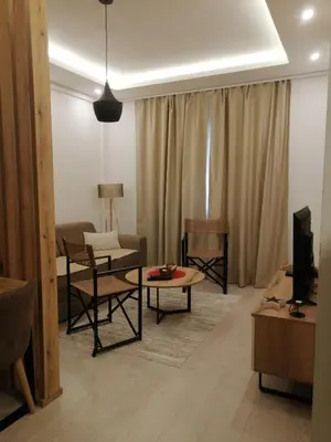 a living room with a couch and a table at Husky N in Raška