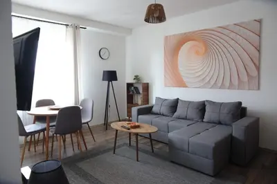 a living room with a couch and a table at Stan na dan in Paraćin