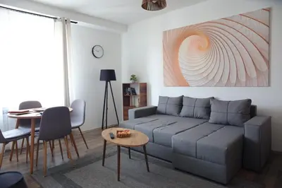 a living room with a couch and a table at Stan na dan in Paraćin