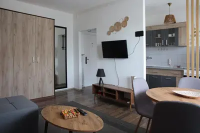 a living room with a couch and a table at Stan na dan in Paraćin