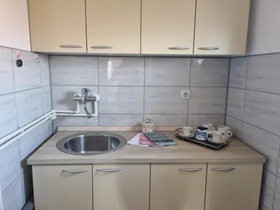 a kitchen with a sink and a counter top at Ana LUX in Dobrosin