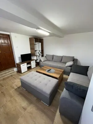 a living room with a couch and a coffee table at Vikendica Bellini 3 in Soko Banja