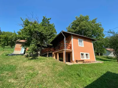a house on top of a grassy hill at Vikendica Bellini 3 in Soko Banja