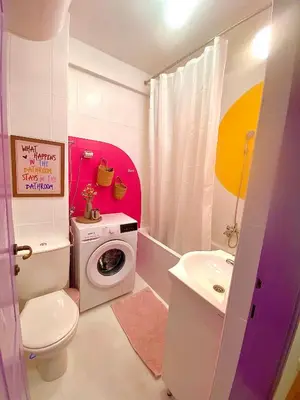 a bathroom with a washing machine and a sink at Happy Place Apartment Pirot in Pirot