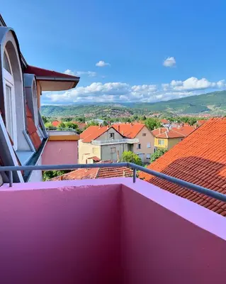 a view from the balcony of a town with roofs at Happy Place Apartment Pirot in Pirot