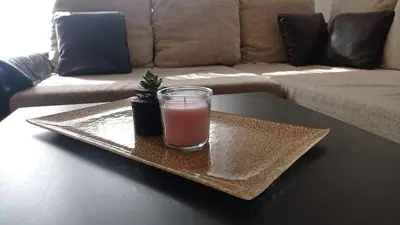 a glass of pink drink on a tray on a table at Aqua 11 big apartment in Jagodina
