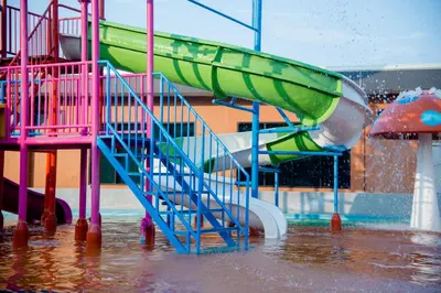 a water park with a slide in the water at Aqua 11 big apartment in Jagodina