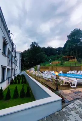 a view of a hotel with a swimming pool at Apartman AQUARELLE sa bazenom, Delux apartman sa bazenom in Vrnjačka Banja