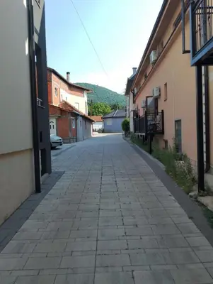an empty street in a town with buildings at Apartman Petrovic 3 in Soko Banja