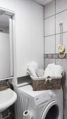 a laundry room with a basket on top of a washing machine at Mila LOFT city center-free parking in Vranje