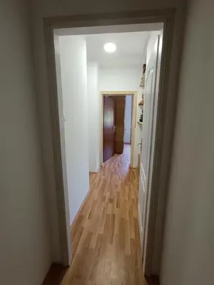 an empty hallway with a hallway leading into a room at Apartmani Trifunović 2 in Soko Banja