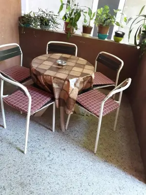 a table and two chairs and a table and a table and chairs at Apartmani Trifunović 2 in Soko Banja