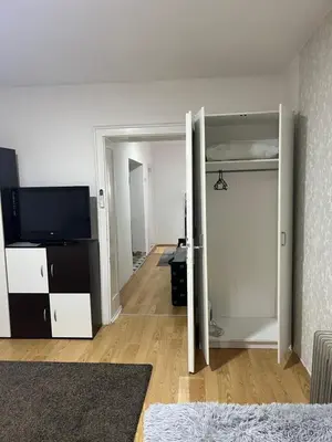 a room with a bedroom with a bunk bed at Lana Apartman in Niš