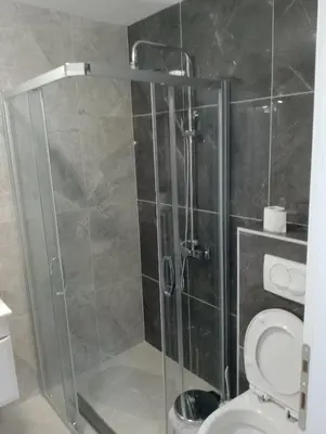 a bathroom with a shower stall with a toilet at Apartman Petrovic 4 in Soko Banja