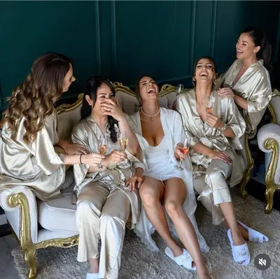 a group of women sitting on a couch with wine glasses at Vila Safra in Vrnjačka Banja