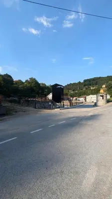 an empty road with a sign on the side of it at Gordana in Senjski Rudnik