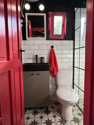 a small bathroom with a toilet and a sink at Trnova Ruzica in Trnovac