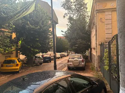 a car parked on a street with parked cars at Rustik in Soko Banja