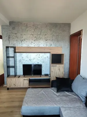 a bedroom with a bed and a flat screen tv at Milijic Lux 2 in Soko Banja