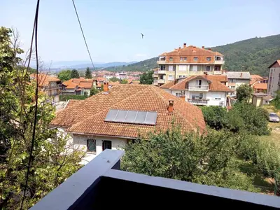 a group of houses with a roof with a solar panel at Apartman KEJ 64m2 in Surdulica
