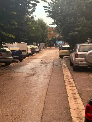 a street with cars parked on the side of the road at Rustik 2 in Soko Banja