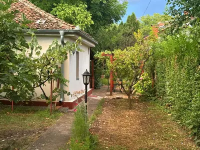 a small house with a path next to a garden at Rustik 2 in Soko Banja