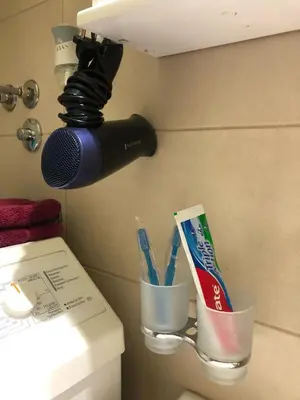 a bathroom with a toothbrush holder and a microphone at ANNI apartman in Paraćin