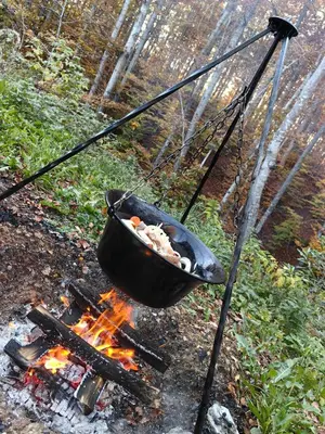 a pot hanging over a fire with a grill at Vila Krunica in Šerdanova Mahala