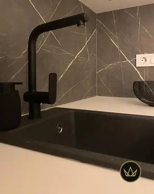 a black sink with a faucet in a bathroom at Metropolitan Royal in Jagodina
