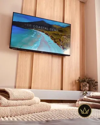 a flat screen tv hanging on a wall at Metropolitan Royal in Jagodina