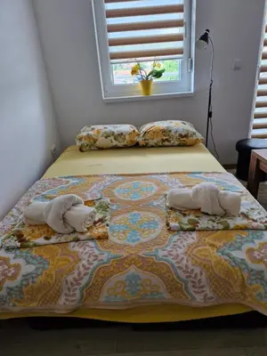 two stuffed animals sitting on top of a bed at Apartman Curcic 1 in Soko Banja