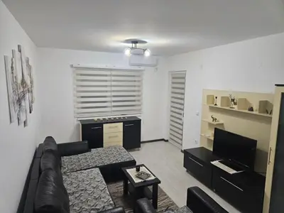a living room with a couch and a table at Apartman Ćurčić in Soko Banja